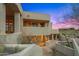 Unique exterior view with layered balconies and beautiful desert landscaping around the property at 10325 E Celestial Dr, Scottsdale, AZ 85262