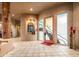 Elegant foyer boasts unique architectural details, decorative lighting, and tile flooring, creating a grand entrance at 10325 E Celestial Dr, Scottsdale, AZ 85262