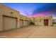 Spacious three-car garage with ample driveway space provides convenient parking and storage options in this desert estate at 10325 E Celestial Dr, Scottsdale, AZ 85262