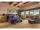 Bright main bedroom with sliding glass doors leading to a private balcony and desert views at 10325 E Celestial Dr, Scottsdale, AZ 85262