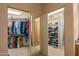 Walk-in closets with custom shelving and storage for clothing and accessories at 10325 E Celestial Dr, Scottsdale, AZ 85262