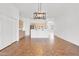 Open dining area featuring modern lighting and kitchen access at 10816 W Palm Ln, Avondale, AZ 85392