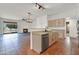 Open kitchen layout with stainless steel appliances and seamless flow to the living area at 10816 W Palm Ln, Avondale, AZ 85392