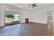 Open concept living room with fireplace, sliding glass door to the pool at 10816 W Palm Ln, Avondale, AZ 85392