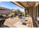 Charming covered patio featuring a ceiling fan, dining table, and relaxing views at 1163 E Holbrook St, Gilbert, AZ 85298