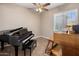 A bonus room features a piano and an organ, and a window with plantation shutters at 1163 E Holbrook St, Gilbert, AZ 85298