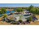 Aerial view of a community splash pad and park area with shaded seating, water features, and picnic areas at 1163 E Holbrook St, Gilbert, AZ 85298