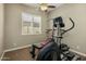 Versatile exercise room featuring a ceiling fan and ample natural light at 1163 E Holbrook St, Gilbert, AZ 85298