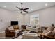 Comfortable living room featuring a ceiling fan, recessed lighting, and plentiful seating at 1163 E Holbrook St, Gilbert, AZ 85298