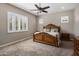 Warm and inviting main bedroom with decorative wood trim and ceiling fan at 1163 E Holbrook St, Gilbert, AZ 85298