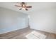 Spacious bedroom with a ceiling fan and wood-look flooring at 11669 N 165Th Ave, Surprise, AZ 85388