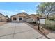 Inviting single-story home with desert landscaping and a well-maintained front yard at 11669 N 165Th Ave, Surprise, AZ 85388