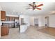 Bright, open concept with island, stainless appliances, and ceiling fan at 11669 N 165Th Ave, Surprise, AZ 85388