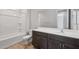 Bathroom featuring a bathtub, toilet and vanity with a sink and mirror at 13512 W Copperleaf Ln, Peoria, AZ 85383