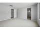 Bright bedroom featuring neutral paint, carpet, and an ensuite bathroom at 13512 W Copperleaf Ln, Peoria, AZ 85383