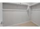 Walk-in closet with ample shelf and rod space for organized storage at 13512 W Copperleaf Ln, Peoria, AZ 85383