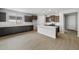 Modern kitchen featuring a large island, stainless steel appliances, and sleek countertops at 13512 W Copperleaf Ln, Peoria, AZ 85383