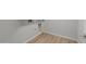 Modern laundry room featuring hookups for washer and dryer and wood-look flooring at 13512 W Copperleaf Ln, Peoria, AZ 85383