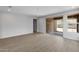 Open living space with a sliding glass door to the backyard and bright natural light at 13512 W Copperleaf Ln, Peoria, AZ 85383