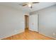 Bedroom with neutral color, wood-look floor, and a closet with double doors at 13536 W Peck Dr, Litchfield Park, AZ 85340