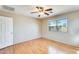 Bedroom with hard wood flooring and ceiling fan and view to the front at 13536 W Peck Dr, Litchfield Park, AZ 85340