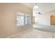 Neutral bedroom featuring large window and tile floors at 13536 W Peck Dr, Litchfield Park, AZ 85340