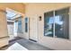 Covered front porch featuring an entry door with sidelight windows at 13536 W Peck Dr, Litchfield Park, AZ 85340