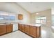 Bright kitchen with lots of countertop space, wood cabinets and white appliances at 13536 W Peck Dr, Litchfield Park, AZ 85340