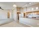 View of the kitchen with neutral walls and laminate counters at 13536 W Peck Dr, Litchfield Park, AZ 85340