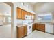 Well-lit kitchen featuring classic cabinetry, appliances, and ample counter space at 13536 W Peck Dr, Litchfield Park, AZ 85340