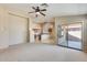 Open concept living room view showcasing the kitchen and outdoor access at 13536 W Peck Dr, Litchfield Park, AZ 85340