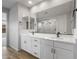Double vanity with modern fixtures, quartz countertop, and ample storage space in this well-lit bathroom at 13757 W Forest Pleasant Pl, Peoria, AZ 85383