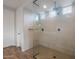 Luxurious glass-enclosed shower with a rainfall shower head and elegant tile, creating a spa-like retreat at 13757 W Forest Pleasant Pl, Peoria, AZ 85383