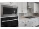 Close up of the kitchen appliances, showing the microwave, oven, and gas range at 13757 W Forest Pleasant Pl, Peoria, AZ 85383
