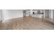 Open concept living room and kitchen with tile floors and ample natural light at 13757 W Forest Pleasant Pl, Peoria, AZ 85383