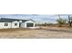 Newly built single-story home featuring a spacious two-car garage and minimal desert landscaping at 2133 N Valley Dr, Apache Junction, AZ 85120