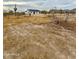 Expansive desert lot with scattered vegetation and a newly constructed home at 2133 N Valley Dr, Apache Junction, AZ 85120