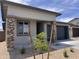 Beautiful single-story home with desert landscaping, a covered entryway, and a two-car garage at 23335 W Monona Ln, Surprise, AZ 85387