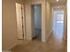 Inviting hallway with tile flooring leading to a bright and spacious living area, perfect for entertaining at 23335 W Monona Ln, Surprise, AZ 85387