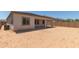 Backyard view of a large lot with covered patio and block fence at 23805 N 163Rd Dr, Surprise, AZ 85387