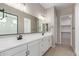 Modern bathroom featuring dual sinks, sleek countertops, and a glass-enclosed shower at 23805 N 163Rd Dr, Surprise, AZ 85387