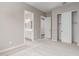 Neutral bedroom featuring a door to the bathroom, sliding door closet and neutral carpet at 23805 N 163Rd Dr, Surprise, AZ 85387