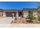 Charming single-story home featuring a two-car garage and low maintenance desert landscaping at 23805 N 163Rd Dr, Surprise, AZ 85387