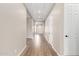 Long hallway with recessed lighting and neutral paint at 23805 N 163Rd Dr, Surprise, AZ 85387