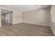 Open living room with neutral walls and luxury vinyl plank flooring at 23805 N 163Rd Dr, Surprise, AZ 85387