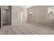 Comfortable main bedroom leading into main bathroom with a glass shower at 23805 N 163Rd Dr, Surprise, AZ 85387