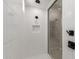 Modern shower with sleek fixtures, white tile, and a convenient inset shelf at 23805 N 163Rd Dr, Surprise, AZ 85387