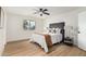 Cozy bedroom featuring a decorative ceiling fan, window, and modern decor provides a relaxing retreat at 252 S Cholla St, Gilbert, AZ 85233