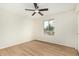 Neutral bedroom with a ceiling fan and natural light from the window at 252 S Cholla St, Gilbert, AZ 85233