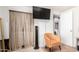 Relaxing bedroom featuring a chair, window, and neutral wall colors at 2939 E Paradise Ln, Phoenix, AZ 85032